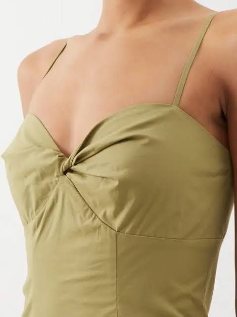 Staud Natalie Midi Dress (Category: Dresses) located in Quezon City. Submitted by bagelll18 (Listing ID 1443133871, Image 2). Description: Worn once only - Olive green maxi dress - Features a flattering twist detail at the bust - Elegant spaghetti straps - High slit on the side for a touch of allure - Adjustable ties at the back for a perfect fit - Ideal for summer events, parties, or a night out.