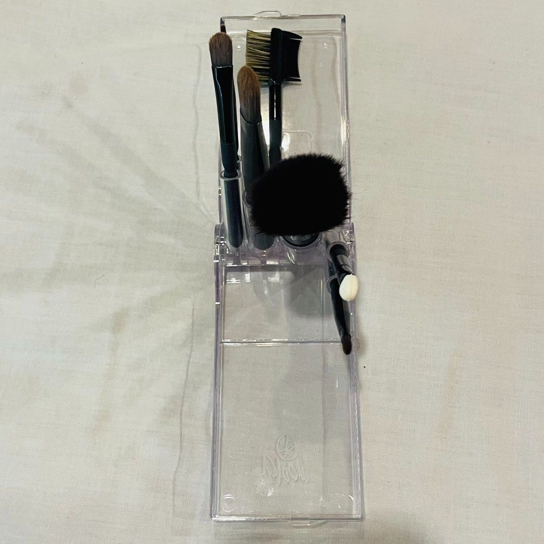 Swatched Only! Authentic Bloom 7 Piece Travel Makeup Brush Set (Category: Makeup) located in Quezon City. Submitted by travelstylelove (Listing ID 1443187563, Image 2). Description: - Bloom 7-piece brush set - Ideal for travel or everyday use - Set includes: powder brush, eye shadow brush, eye blending brush, eye liner brush, lash & brow groomer, sponge tip applicator, and lip brush - Comes in a compact case for easy storage and portability.