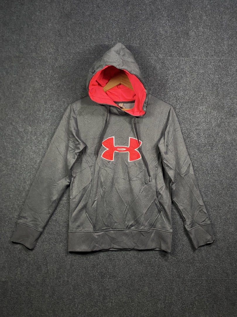 Under Armour Grey Hoodie with Red Lining (Category: Hoodies) located in Bolinao. Submitted by frenced28 (Listing ID 1443264834, Image 1). Description: Wide:19 length:24.5 - Grey Under Armour hoodie - Red lining inside the hood - Under Armour logo on the front - Kangaroo pocket - Drawstrings for the hood - Size XS/TP/EP.