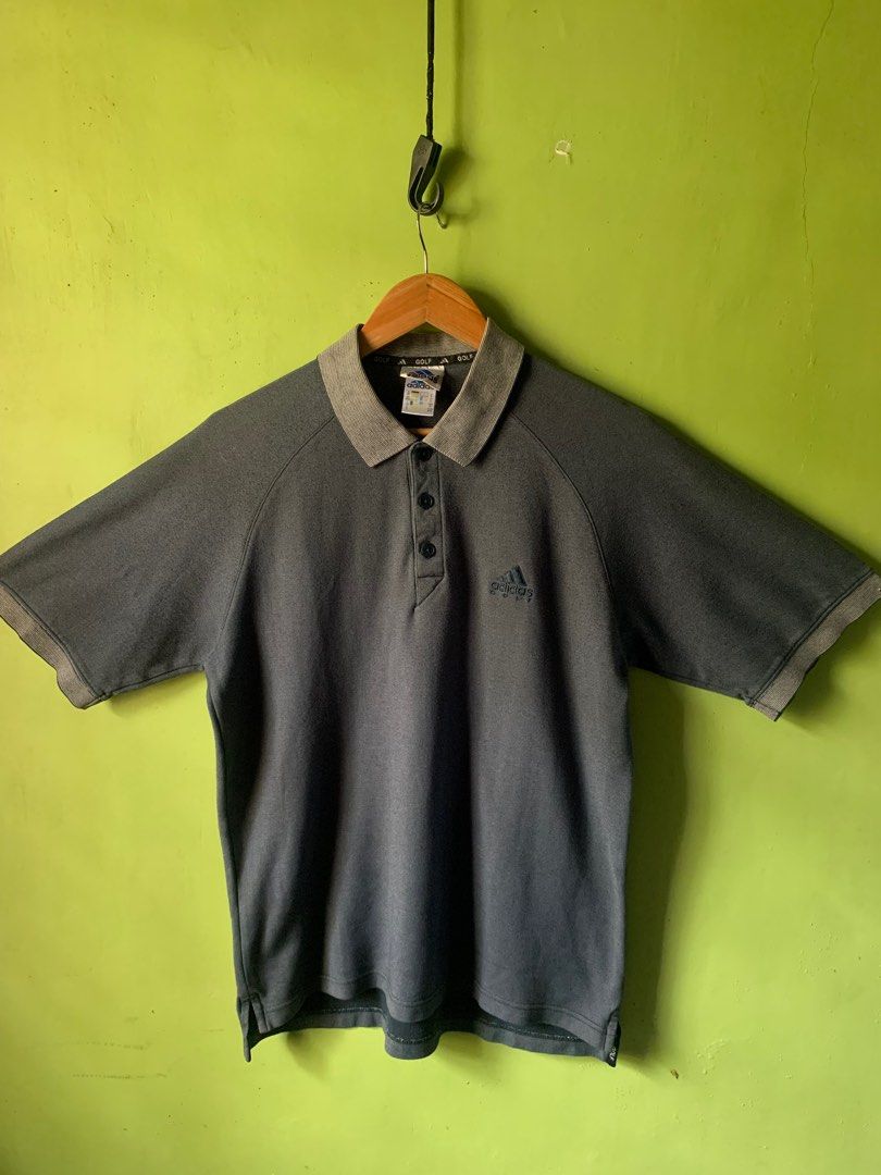 Vintage 1990s Adidas golf button up polo (Category: Tshirts & Polo Shirts ) located in Cagayan de Oro. Submitted by premium_thrifts (Listing ID 1443179847, Image 1). Description: Gray green colorway. Good condition. Issues: minimal lints, and 2 scratches - MEASUREMENTS: L26.2/27.5" x W20.5" Fits Medium - Large Add shipping fee (via JRS or J&T).