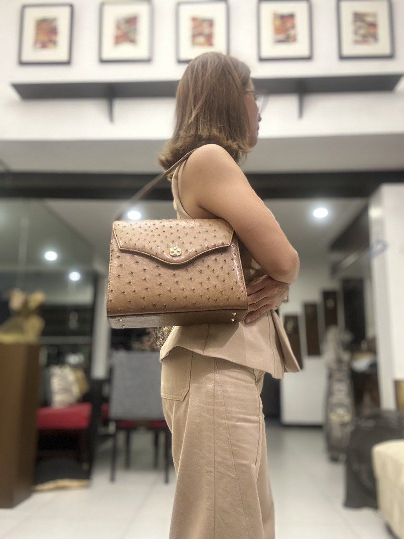Vintage Ostrich Leather Handbag (Category: Luxury Bags & Wallets) located in Mandaluyong City. Submitted by purselove (Listing ID 1422606116, Image 2). Description: - Vintage ostrich leather handbag - Features a flap closure with a gold-tone clasp - Structured shape with top handle - Showcases distinctive ostrich leather texture - Classic design, suitable for various occasions.