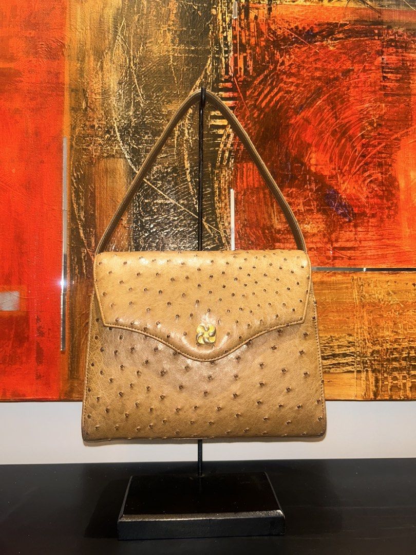Vintage Ostrich Leather Handbag (Category: Luxury Bags & Wallets) located in Mandaluyong City. Submitted by purselove (Listing ID 1422606116, Image 1). Description: - Vintage ostrich leather handbag - Features a flap closure with a gold-tone clasp - Structured shape with top handle - Showcases distinctive ostrich leather texture - Classic design, suitable for various occasions.