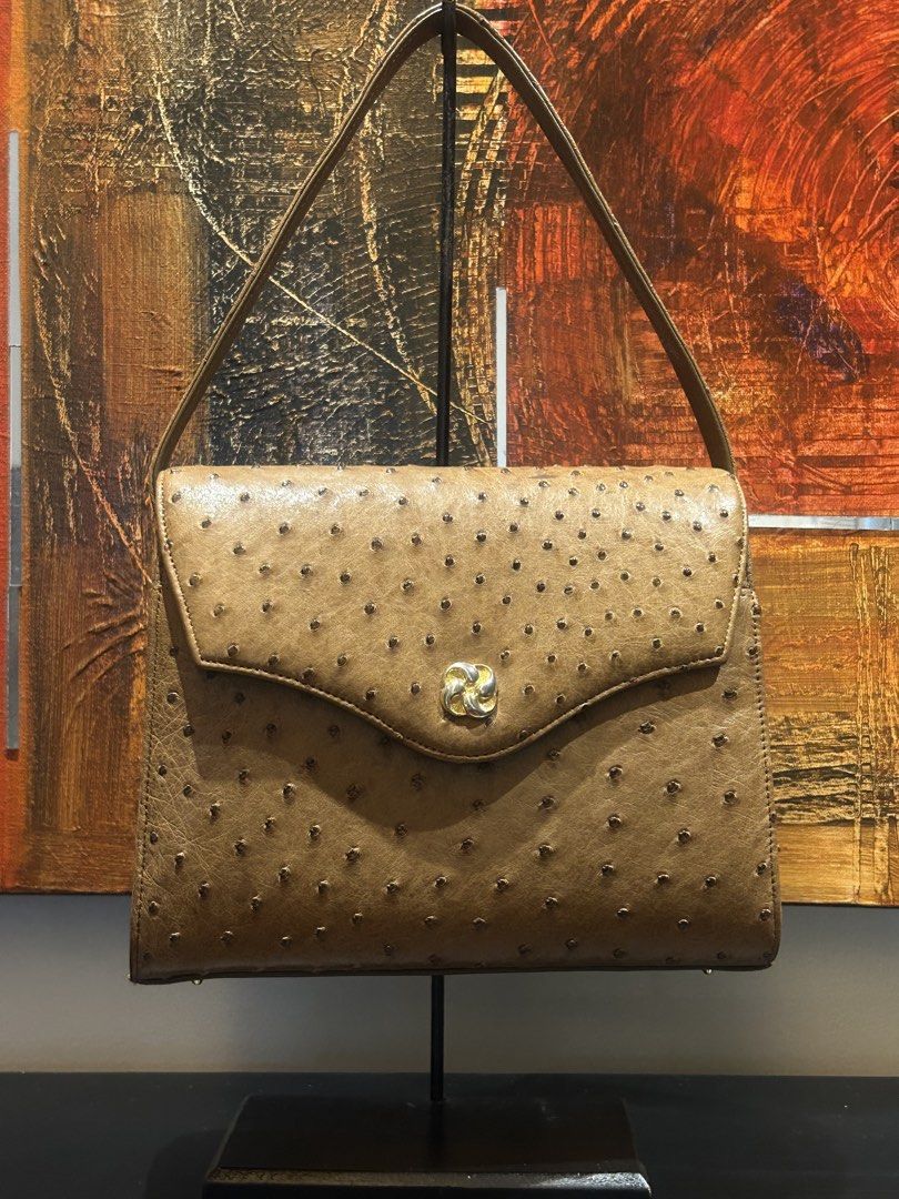 Vintage Ostrich Leather Handbag (Category: Luxury Bags & Wallets) located in Mandaluyong City. Submitted by purselove (Listing ID 1422606116, Image 3). Description: - Vintage ostrich leather handbag - Features a flap closure with a gold-tone clasp - Structured shape with top handle - Showcases distinctive ostrich leather texture - Classic design, suitable for various occasions.