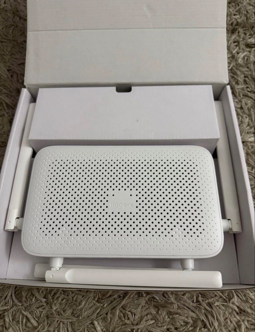 Xiaomi AX1500 WiFi 6 Router (Category: Networking) located in Manila. Submitted by ghieuy (Listing ID 1443277495, Image 2). Description: - Xiaomi AX1500 WiFi 6 Router - Up to 1500 Mbps speeds - All Gigabit Ethernet ports - Supports IPTV - Xiaomi Mesh Networking compatible - Includes original box and power adapter - Experience fast and reliable internet connectivity.