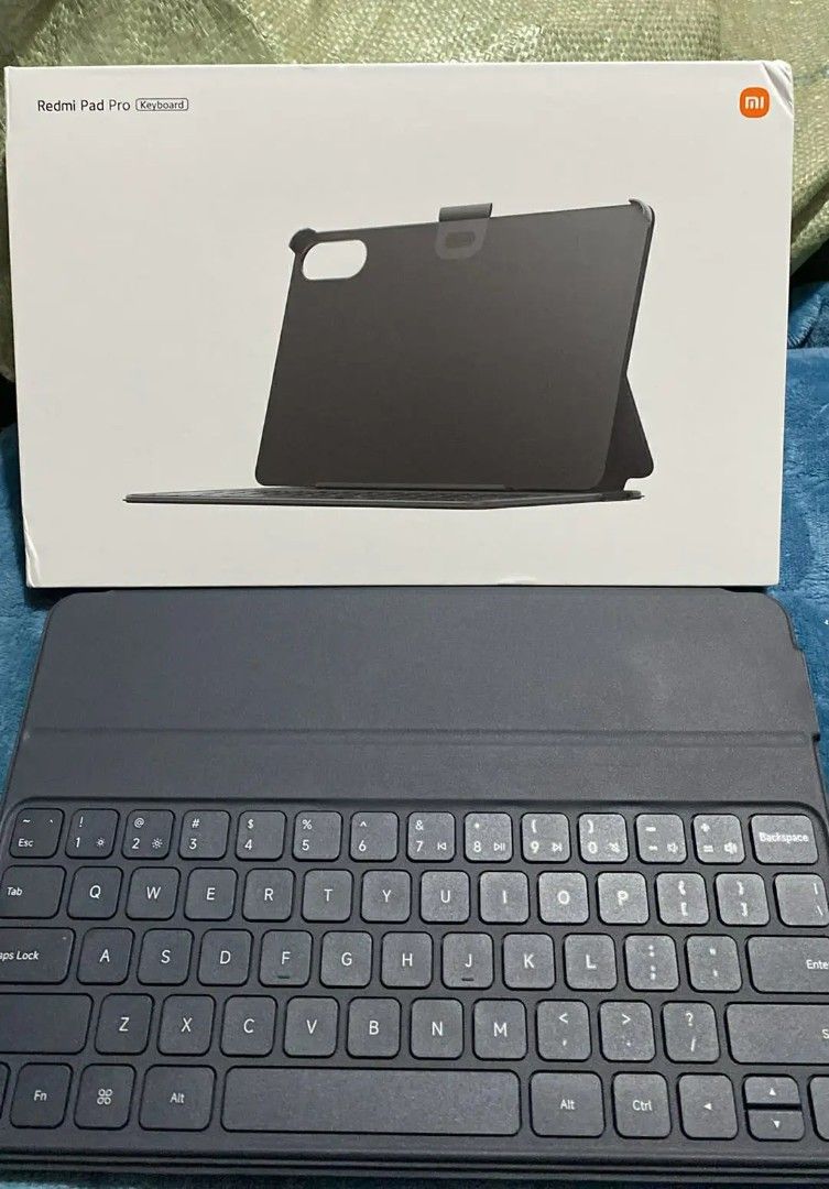 Xiaomi Redmi Pad Pro Keyboard Case (Category: Android) located in Taguig. Submitted by jerafelsan87737 (Listing ID 1443312482, Image 1). Description: - Original Xiaomi Keyboard Case for Redmi Pad Pro - Magnetic attachment for secure fit - Protects your tablet - Provides a comfortable typing experience - Ideal for work or study on the go.