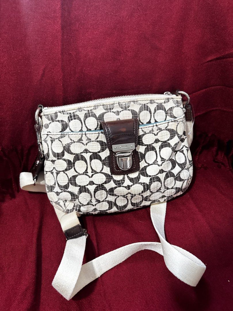 Y2k Coach Poppy Metallic Swing-back Crossbody Bag (Category: Luxury Bags & Wallets) located in San Francisco. Submitted by wisetimepieces (Listing ID 1443225621, Image 1). Description: No hangtag but may eteketa (this design does not have a stamped creed) Good condition body with some discoloration (yellowing) Cracked rubber linings/ heavily used leather parts dry and has micro cracks (please check photos) Sling needs cleaning .