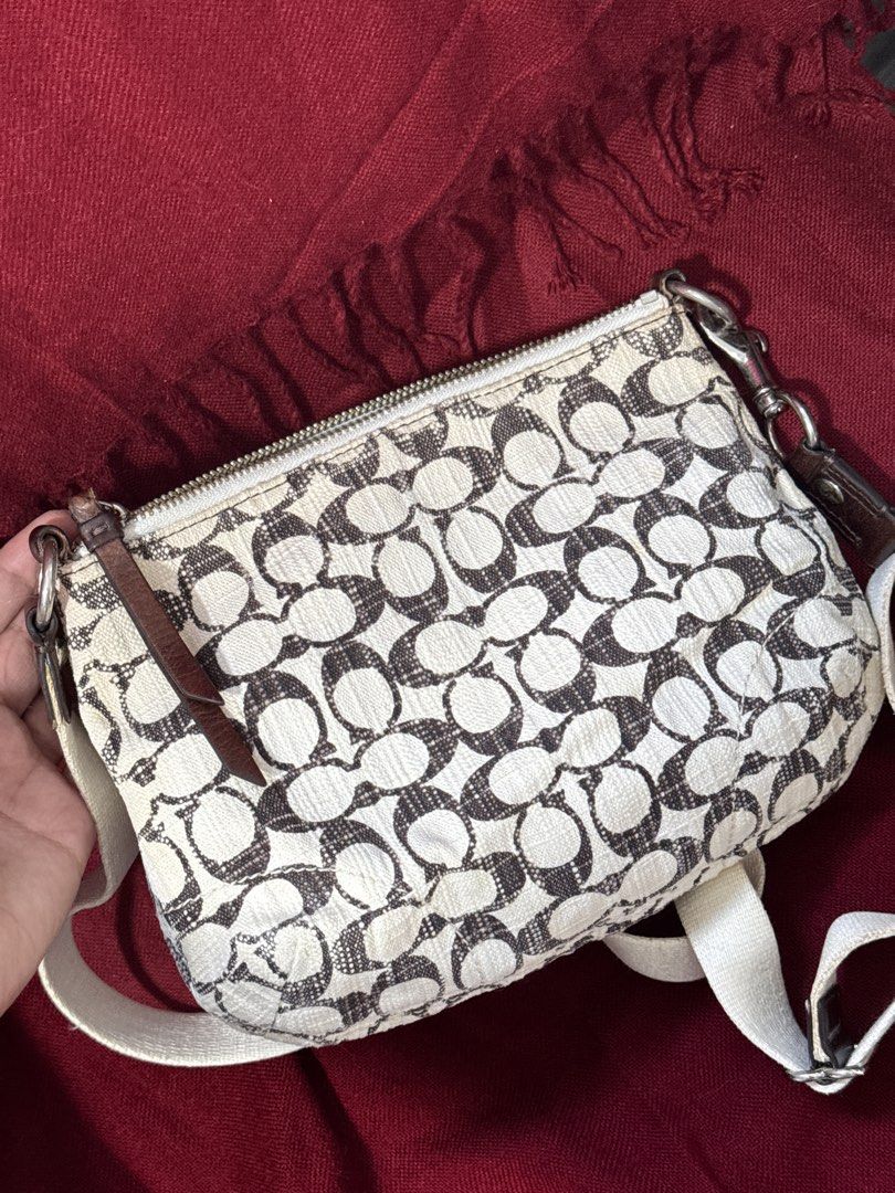 Y2k Coach Poppy Metallic Swing-back Crossbody Bag (Category: Luxury Bags & Wallets) located in San Francisco. Submitted by wisetimepieces (Listing ID 1443225621, Image 2). Description: No hangtag but may eteketa (this design does not have a stamped creed) Good condition body with some discoloration (yellowing) Cracked rubber linings/ heavily used leather parts dry and has micro cracks (please check photos) Sling needs cleaning .