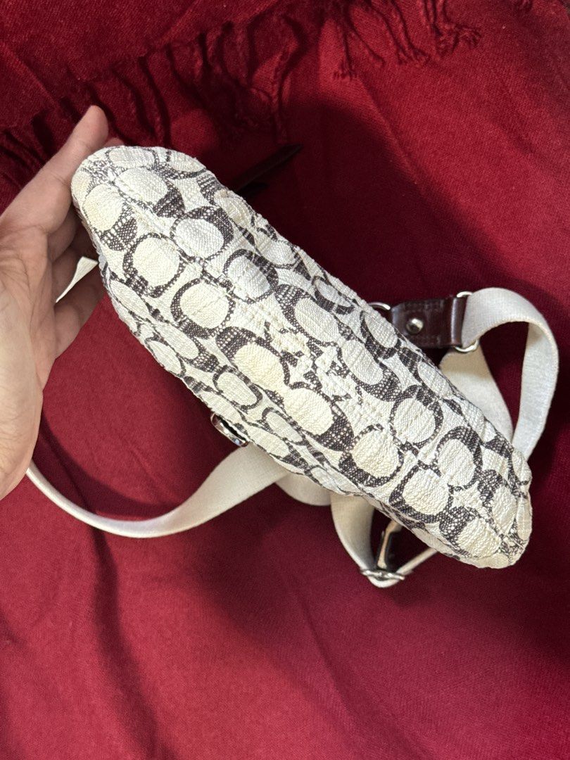 Y2k Coach Poppy Metallic Swing-back Crossbody Bag (Category: Luxury Bags & Wallets) located in San Francisco. Submitted by wisetimepieces (Listing ID 1443225621, Image 3). Description: No hangtag but may eteketa (this design does not have a stamped creed) Good condition body with some discoloration (yellowing) Cracked rubber linings/ heavily used leather parts dry and has micro cracks (please check photos) Sling needs cleaning .
