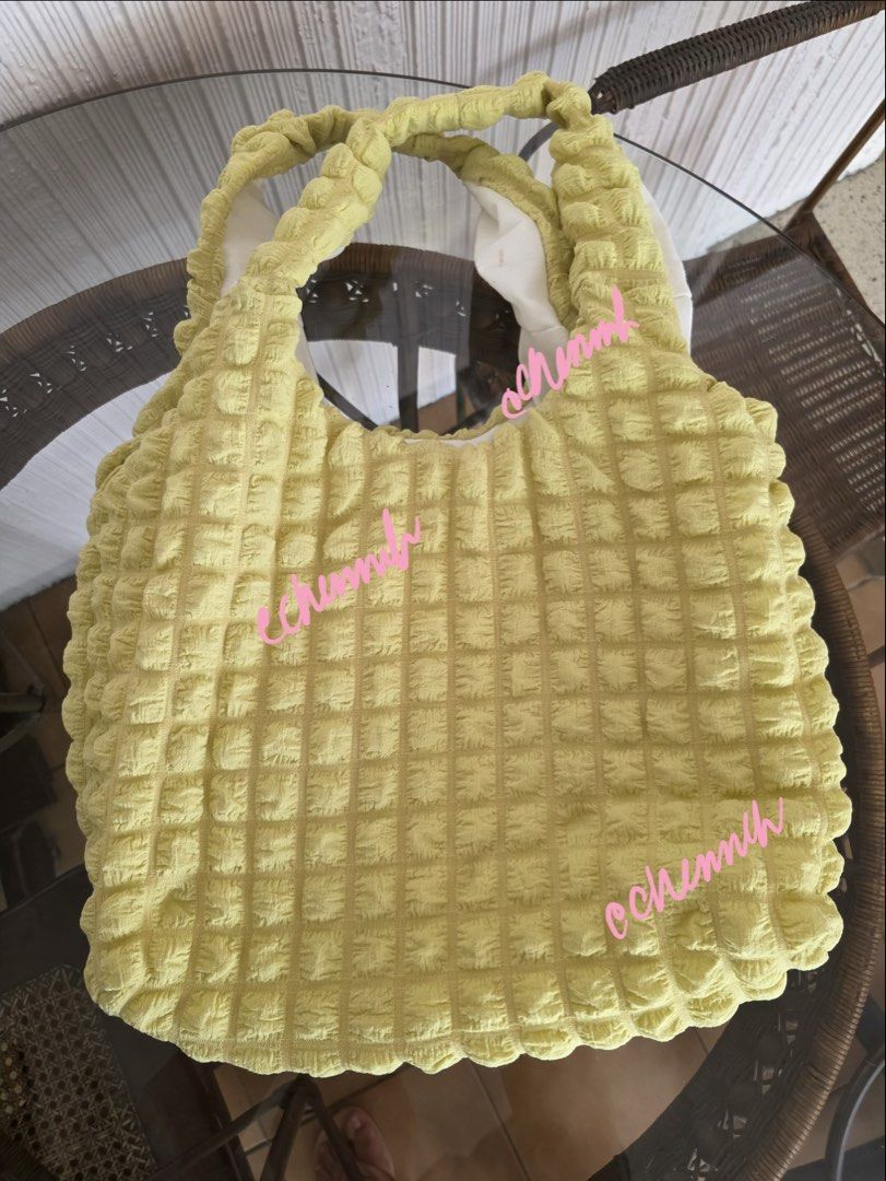 Yellow Textured Tote Bag with Ruched Handles (Category: Tote Bags) located in Pasig City. Submitted by jennasantos (Listing ID 1443288475, Image 2). Description: - Adorable yellow tote bag - Features a unique all-over textured pattern - Soft, ruched handles for comfort - Lined with white fabric inside - Ideal size for everyday essentials - Great for casual outings - Bought from Thailand SRP: P680 Shipping from Pasig - to be shouldered by buyer Sh