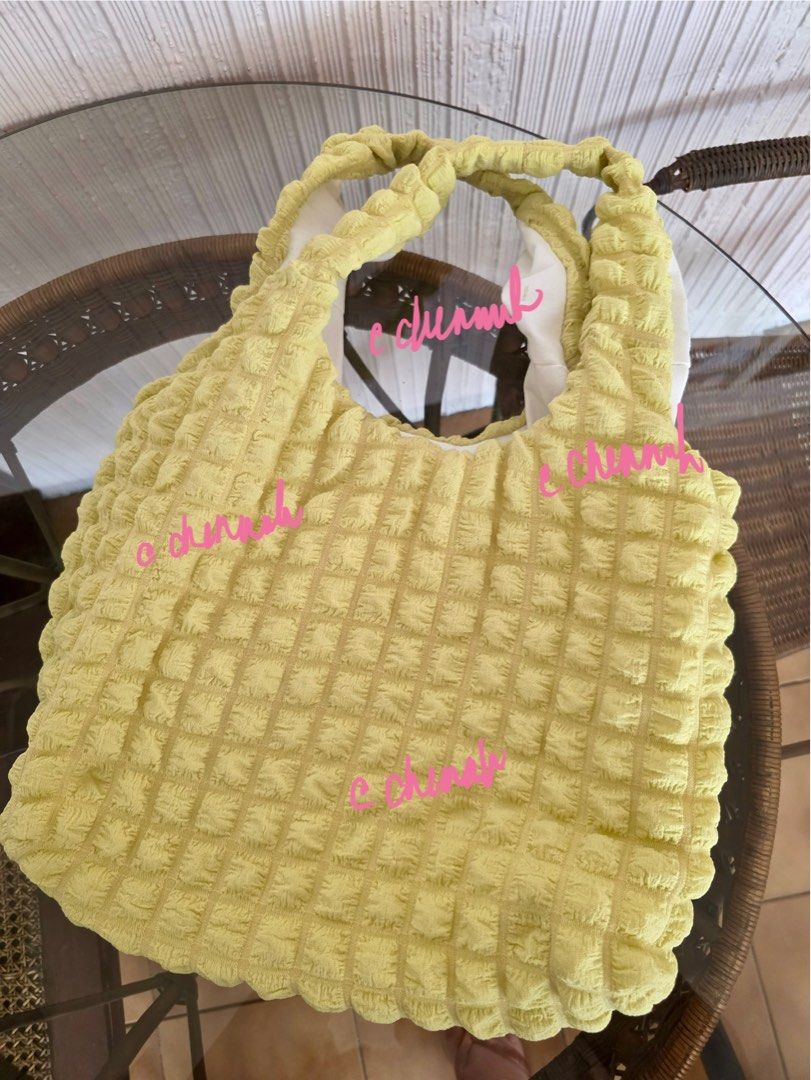 Yellow Textured Tote Bag with Ruched Handles (Category: Tote Bags) located in Pasig City. Submitted by jennasantos (Listing ID 1443288475, Image 3). Description: - Adorable yellow tote bag - Features a unique all-over textured pattern - Soft, ruched handles for comfort - Lined with white fabric inside - Ideal size for everyday essentials - Great for casual outings - Bought from Thailand SRP: P680 Shipping from Pasig - to be shouldered by buyer Sh