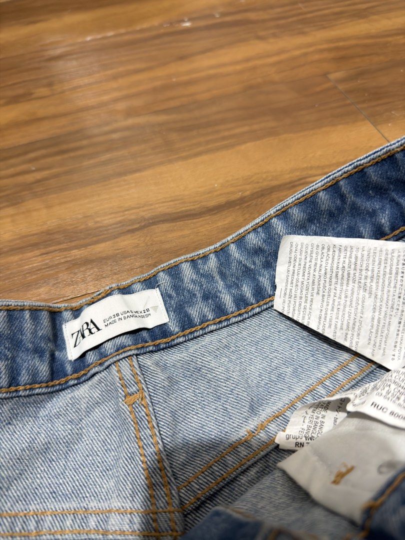 Zara Blue Distressed Denim Cut-Off Shorts (Category: Shorts) located in Caloocan City. Submitted by MSCloset_ (Listing ID 1443214465, Image 3). Description: - Classic blue denim shorts from Zara - High-waisted style - Distressed look with ripped details - Frayed hems - Versatile for casual wear, pairs easily with any top.