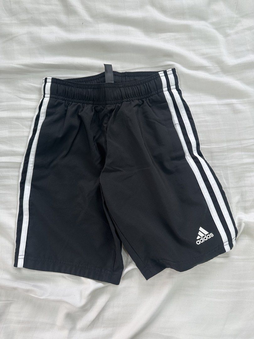 Adidas Black Shorts with White Stripes (Category: Babies & Kids Fashion) located in Quezon City. Submitted by _cc_declutters (Listing ID 1443378173, Image 1). Description: - Classic black Adidas shorts - Iconic white side stripes - Comfortable elastic waistband - Versatile for sports and casual outfits - Size 128 - Proudly made in the Philippines.