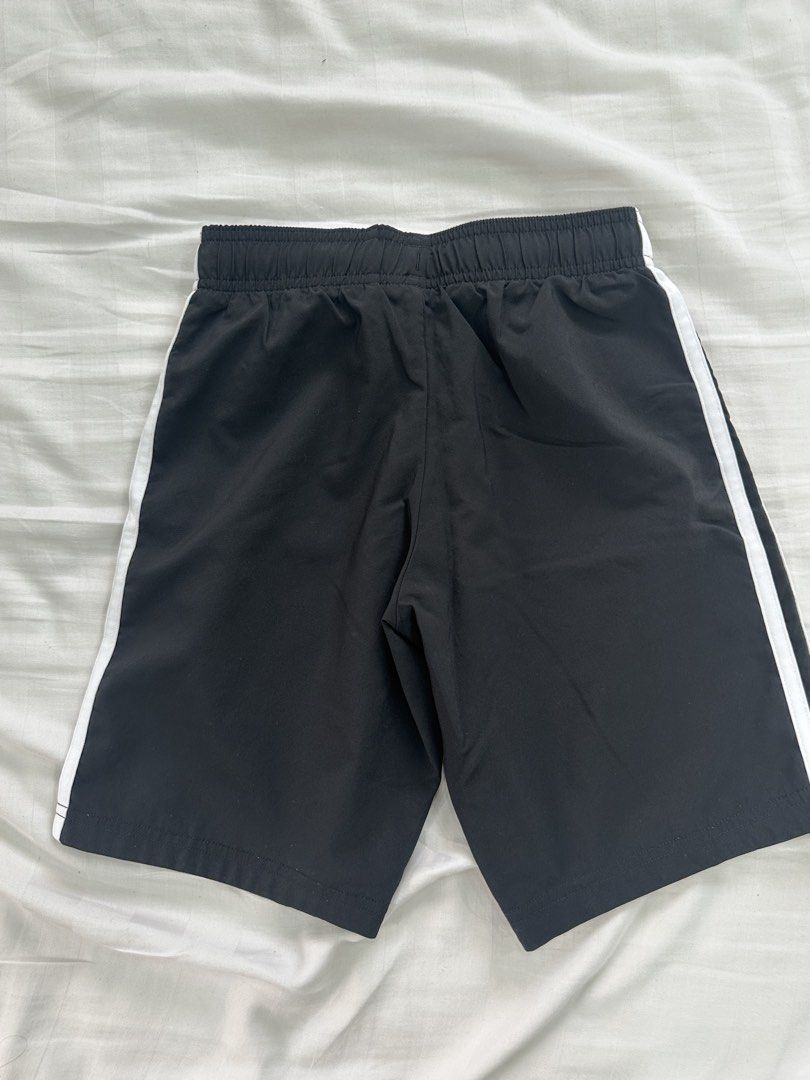 Adidas Black Shorts with White Stripes (Category: Babies & Kids Fashion) located in Quezon City. Submitted by _cc_declutters (Listing ID 1443378173, Image 3). Description: - Classic black Adidas shorts - Iconic white side stripes - Comfortable elastic waistband - Versatile for sports and casual outfits - Size 128 - Proudly made in the Philippines.