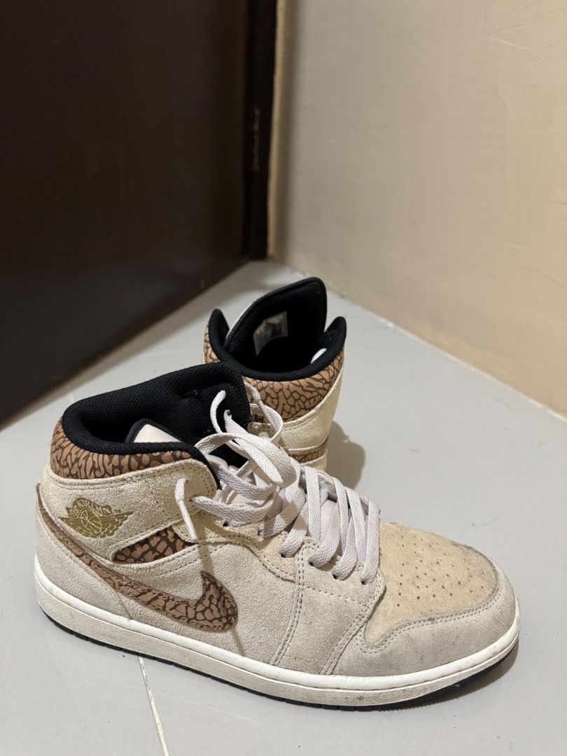 Air Jordan 1 Mid Elephant Print Beige (Category: Sneakers) located in Manila. Submitted by saluzblanco (Listing ID 1443357783, Image 1). Description: - Authentic Air Jordan 1 Mid sneakers - Beige suede upper - Elephant print accents on swoosh and heel collar - Classic high-top silhouette - Light grey laces - Ideal for casual and everyday wear.