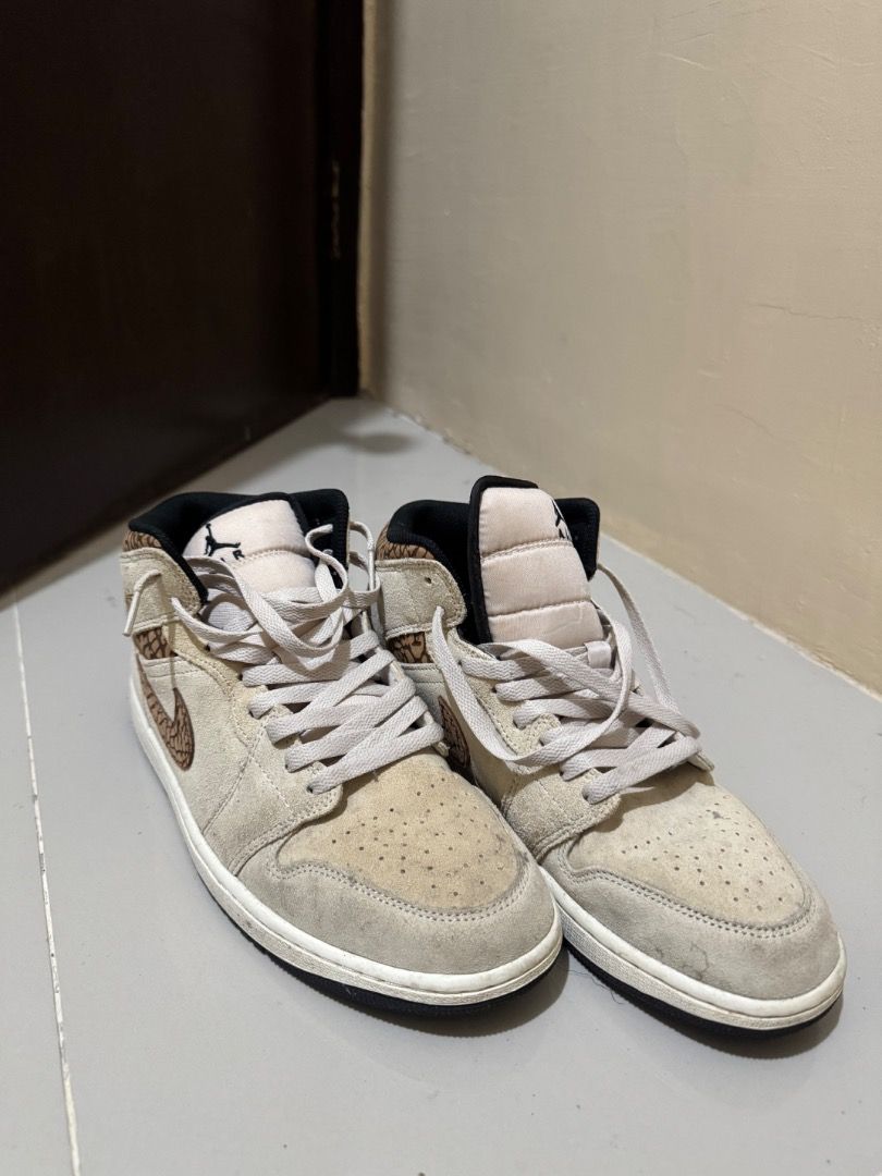 Air Jordan 1 Mid Elephant Print Beige (Category: Sneakers) located in Manila. Submitted by saluzblanco (Listing ID 1443357783, Image 2). Description: - Authentic Air Jordan 1 Mid sneakers - Beige suede upper - Elephant print accents on swoosh and heel collar - Classic high-top silhouette - Light grey laces - Ideal for casual and everyday wear.