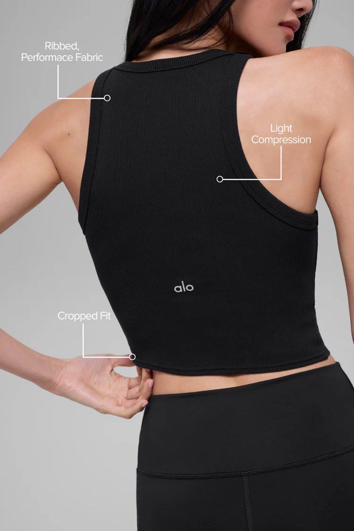 Alo Goddess Ribbed Go-To Tank Black XS (Category: Activewear) located in Singapore. Submitted by shopthemoon (Listing ID 1443344482, Image 2). Description: - RTP: $94 - Brand: Alo Yoga - Color: Black - Style: Ribbed Cropped Tank Top - Features: Light compression, performance fabric - Fit: Cropped - Comfort: Super comfortable and stretchy - Versatility: Great for workouts or everyday wear.