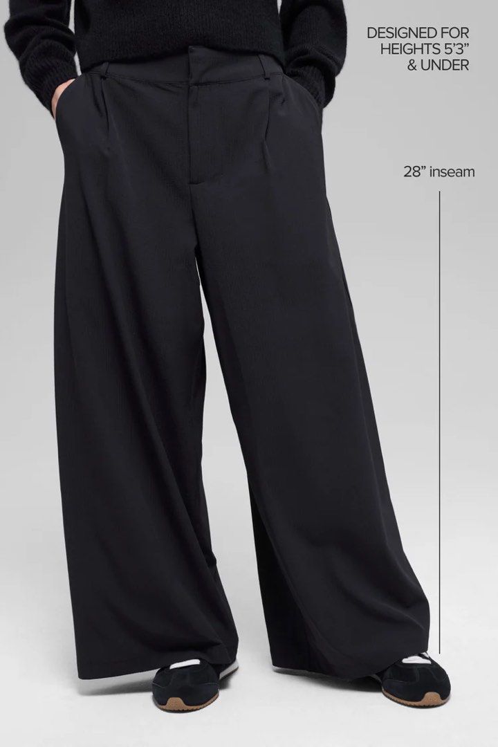 Alo High-Waist Dreamscape Trouser (Short) (Category: Jeans & Leggings) located in Singapore. Submitted by poohsellstuff (Listing ID 1443371567, Image 1). Description: Worn once. - Wide-leg black pants - High-waisted with pleats - Loose, relaxed fit - 28" inseam - Best for heights 5'3" and under - Comfortable and stylish - Ideal for everyday wear.
