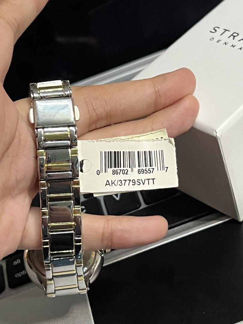 Anne Klein Two-Tone Watch with Crystal Bezel (Category: Women's Watches) located in Antipolo. Submitted by stormieluv (Listing ID 1443410473, Image 3). Description: - Anne Klein two-tone metal band watch - White dial with gold-tone hour markers and hands - Sparkling crystal bezel - Includes original box - Japan movement, China band - Model: AK/3779SVTT BRAND NEW !!! natambak lang !! bought from DUBAI.