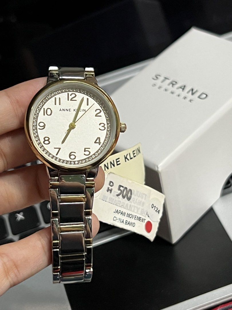 Anne Klein Two-Tone Watch with Crystal Bezel (Category: Women's Watches) located in Antipolo. Submitted by stormieluv (Listing ID 1443410473, Image 2). Description: - Anne Klein two-tone metal band watch - White dial with gold-tone hour markers and hands - Sparkling crystal bezel - Includes original box - Japan movement, China band - Model: AK/3779SVTT BRAND NEW !!! natambak lang !! bought from DUBAI.