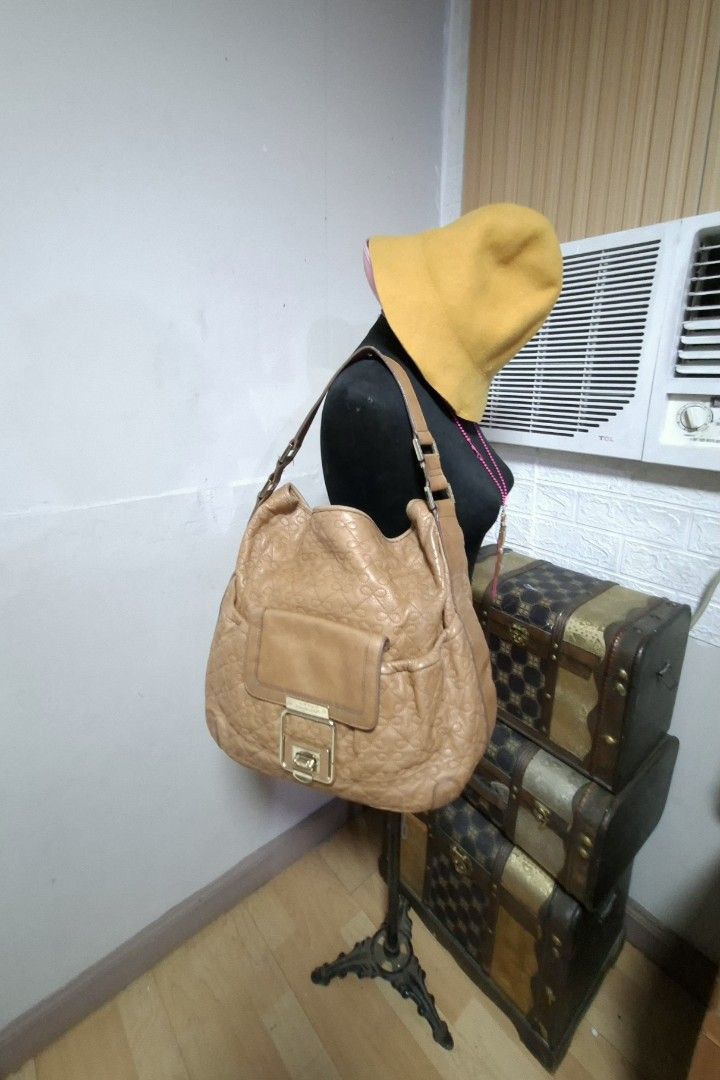 Anya Hindmarch (Category: Luxury Bags & Wallets) located in Manila. Submitted by givesudlyt08 (Listing ID 1443410096, Image 1). Description: Bow stitched hobo bag, vintage inspired design soft,light brown calf leather.interior, lined w/ultra soft biege suede.push lock.measures 13"inx12.5x4.5.