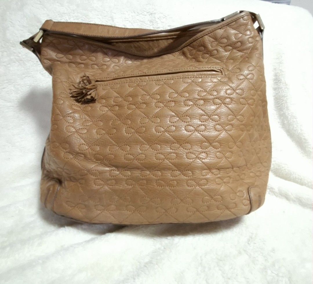 Anya Hindmarch (Category: Luxury Bags & Wallets) located in Manila. Submitted by givesudlyt08 (Listing ID 1443410096, Image 3). Description: Bow stitched hobo bag, vintage inspired design soft,light brown calf leather.interior, lined w/ultra soft biege suede.push lock.measures 13"inx12.5x4.5.