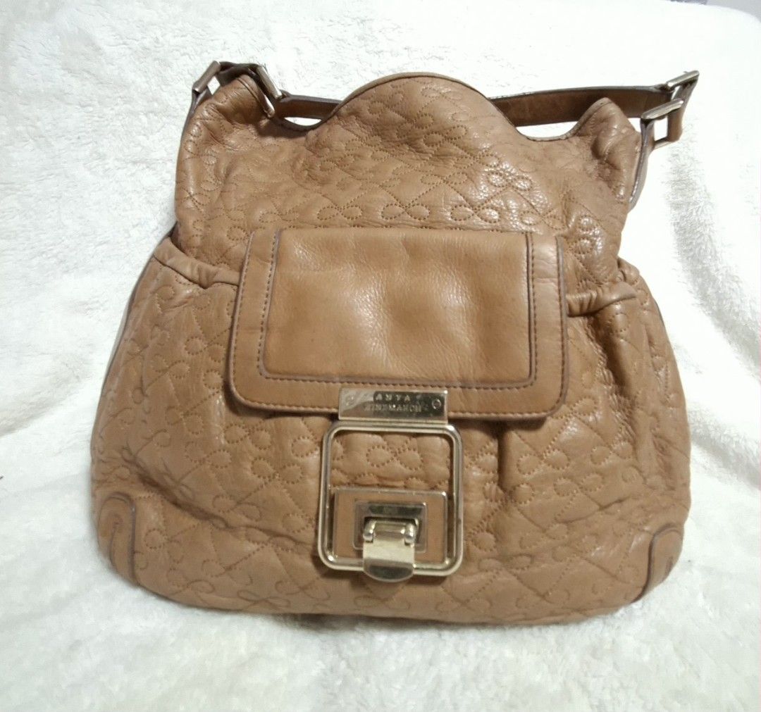 Anya Hindmarch (Category: Luxury Bags & Wallets) located in Manila. Submitted by givesudlyt08 (Listing ID 1443410096, Image 2). Description: Bow stitched hobo bag, vintage inspired design soft,light brown calf leather.interior, lined w/ultra soft biege suede.push lock.measures 13"inx12.5x4.5.