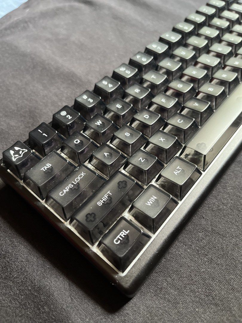 Arbiter Pro TKL 65% Keyboard (Category: Computer Keyboard) located in Quezon City. Submitted by toasterpiee (Listing ID 1443355492, Image 2). Description: DM for more info or pics - Compact 60% layout saves valuable desk space. - Premium black alloy frame for durability and style. - Unique custom keycaps with a smoky translucent design. - Wired for reliable performance. - Perfect for gamers, coders, and minimalist setups..