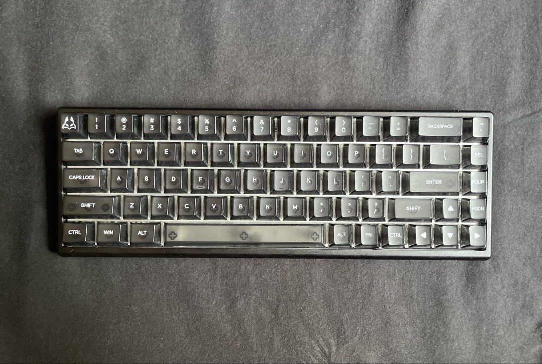 Arbiter Pro TKL 65% Keyboard (Category: Computer Keyboard) located in Quezon City. Submitted by toasterpiee (Listing ID 1443355492, Image 1). Description: DM for more info or pics - Compact 60% layout saves valuable desk space. - Premium black alloy frame for durability and style. - Unique custom keycaps with a smoky translucent design. - Wired for reliable performance. - Perfect for gamers, coders, and minimalist setups..