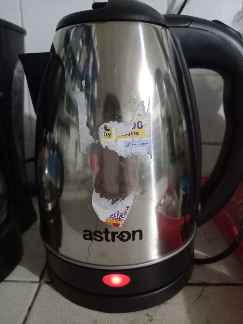 Astron Stainless Steel Electric Kettle (Category: Kettles & Airpots) located in Taytay. Submitted by decluttering_is_fun_by_dr_a (Listing ID 1443427467, Image 1). Description: - Astron electric kettle Brand new - Stainless steel body - Red indicator light when on - Minor sticker residue on side - Clean interior - Perfect for quick water boiling.