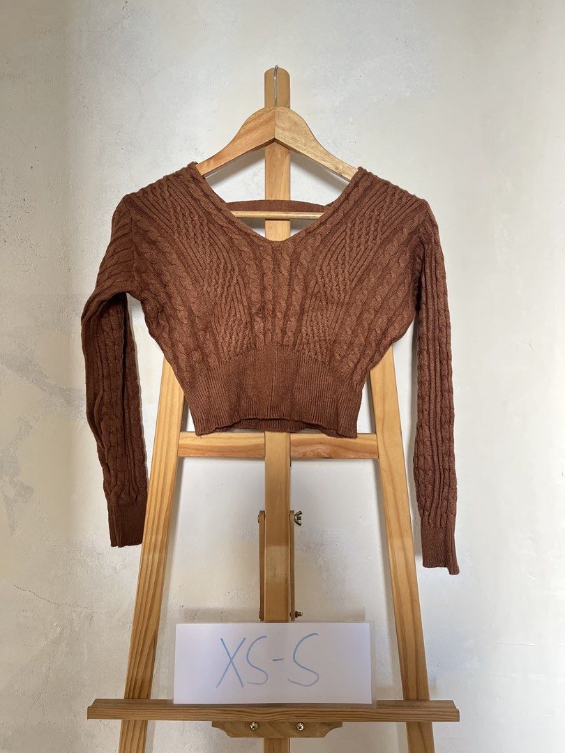 Brown Cable Knit V-Neck Cropped Sweater (Category: Longsleeves) located in Baguio. Submitted by threadsandcrafts (Listing ID 1443360862, Image 1). Description: - Cute brown cropped sweater - Cozy cable knit pattern - Flattering V-neck design - Stylish back strap detail - Long sleeves with ribbed cuffs - Ideal for pairing with high-waisted bottoms - Comfortable and chic.