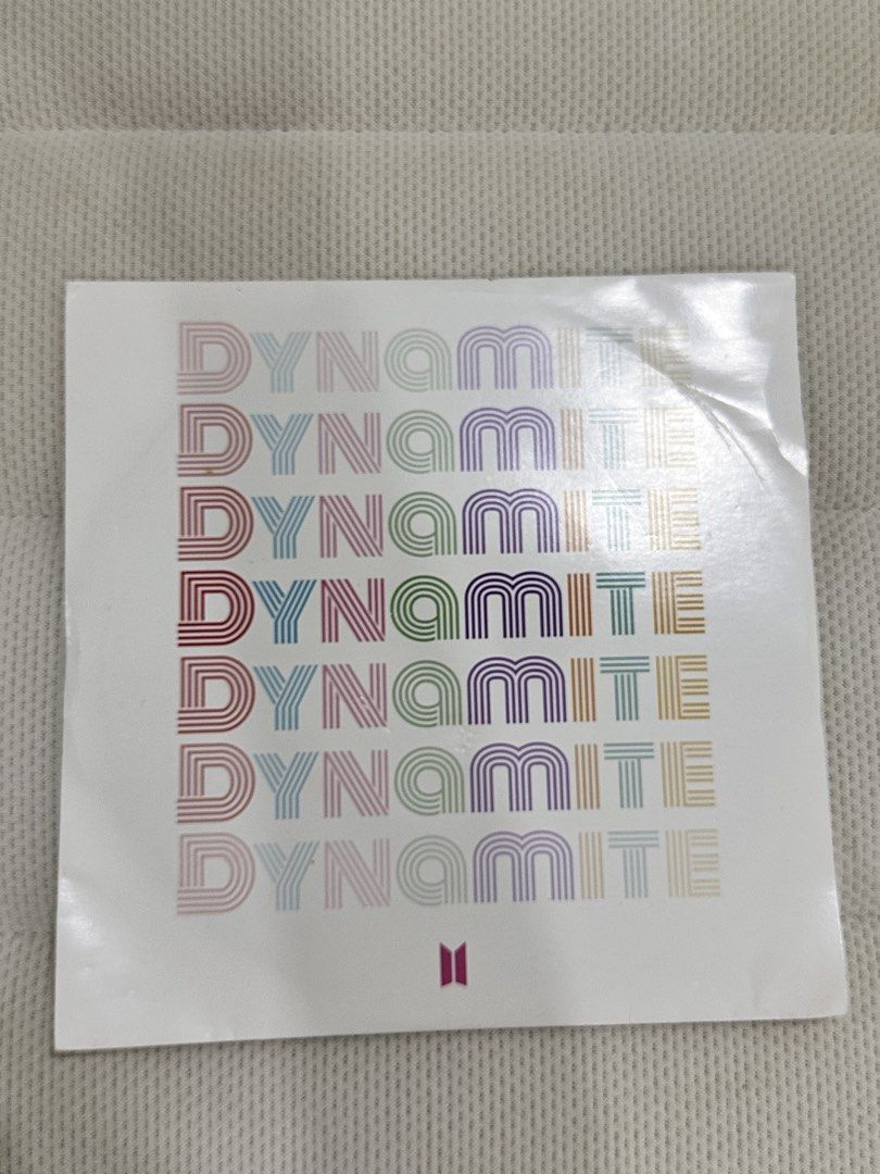 BTS Dynamite 7" Vinyl Record Single (Category: Vinyls) located in Agdangan. Submitted by mvania (Listing ID 1443429244, Image 3). Description: REASON FOR SELLING: Never got to try it. I don't have a vinyl player. Also the case has dents but the vinyl is still fine - Authentic BTS 'Dynamite' Vinyl Single - Features the hit song 'Dynamite' - Comes with original sleeve - Black vinyl with 'Dynamite' label - Sleeve design: Rainbow 'Dynamite' text and 