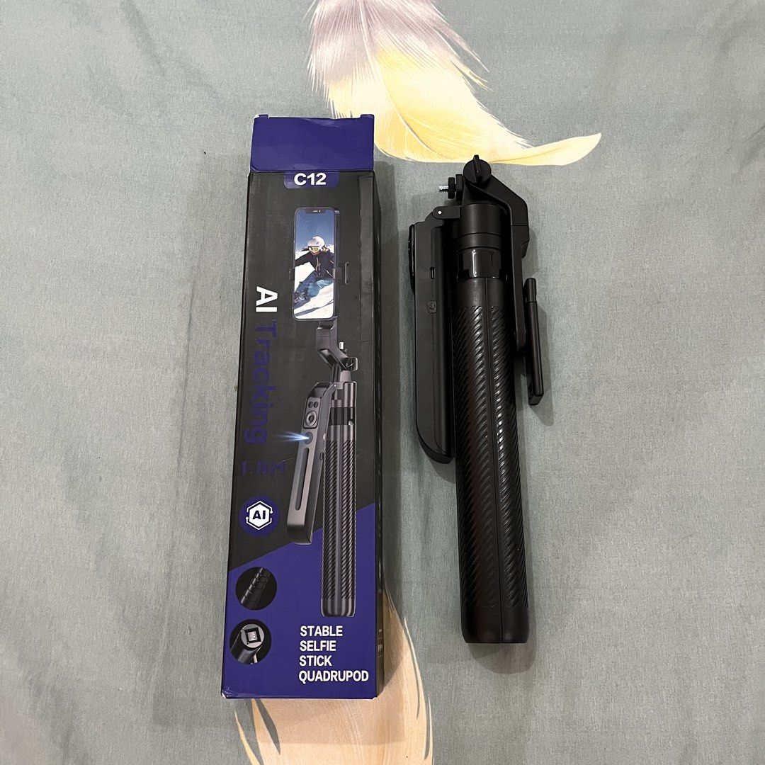 C12 AI Tracking Tripod (Category: Tripods & Monopods) located in Manila. Submitted by princess.01.1 (Listing ID 1443335573, Image 1). Description: Bought it for 1300. Used once The C12 AI Tracking Tripod is a 3-in-1 motorized selfie stick and quadripod that uses a built-in AI camera to track your face or body in real-time. Because the AI is built directly into the device, it tracks your movements automatically without needing any third-party apps