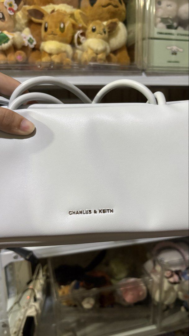 Charles & Keith Coquette Light Blue Shoulder Bag (Category: Shoulder Bags) located in Pasay City. Submitted by tiedshoelaces (Listing ID 1443324727, Image 2). Description: Please read everything: For sale: ⭐️ Charles and Keith Shoulder Bag - light/pale blue - with very cute ribbons - rarely used, in very good-excellent condition - will come with its original dust bag - main compartment: zipper - sides have magnetic closure ⭐️ price: as listed + s