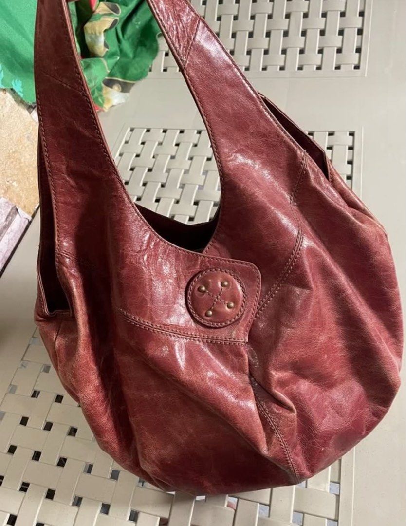 cherry red vintage vibes hobo bag (Category: Shoulder Bags) located in Cabuyao City. Submitted by kisyana (Listing ID 1433554023, Image 3). Description: - Red leather hobo bag - Single handle - Button closure - Slouchy design - Soft leather - Classic everyday bag.
