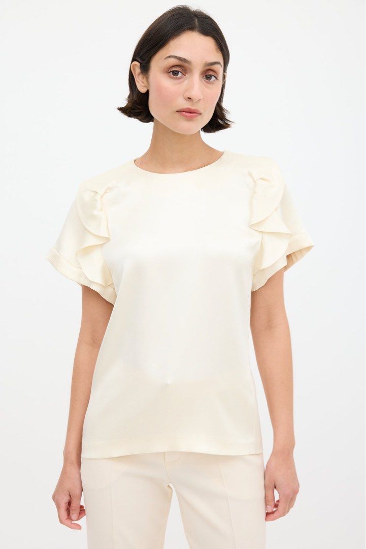 Chloé - Silk - Ruffle Sleeve Top (Category: Blouses) located in Quezon. Submitted by _sortofgoodsph (Listing ID 1443460075, Image 2). Description: Chloé - Cream - Silk - Pleated - Ruffle Sleeve Top Size 34 on tag Dimensions: Pit to pit - 16” Length - 24.5” Sleeve - 11” Hem - 16.5” Brand new with tags No issue *ACTUAL COLOR OF THE ITEM MAY CHANGE DUE TO LIGHTING* Note: Feel free to ask questions before purchasing.