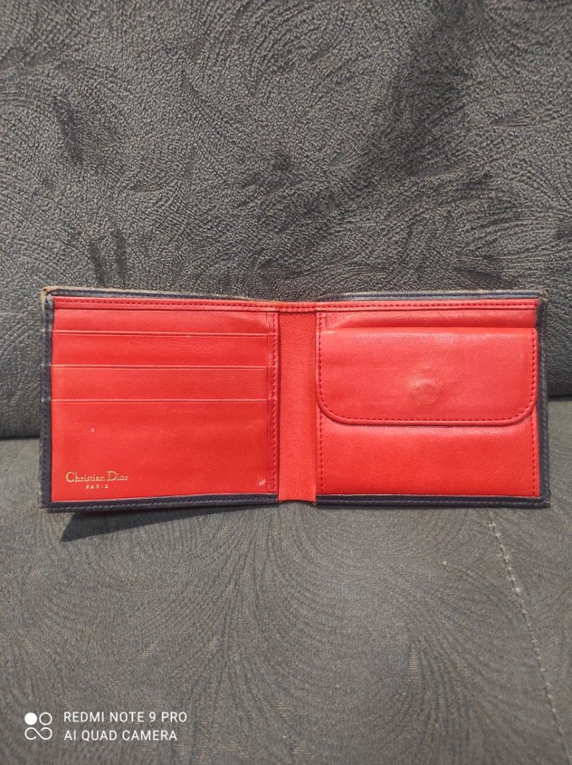 Christian Dior CD Monogram Leather Bifold Wallet (Category: Luxury Bags & Wallets) located in Mabalacat. Submitted by _limitlessfashion (Listing ID 1443412322, Image 3). Description: - Vintage Christian Dior bifold wallet - Guaranteed Authentic - Leather all the way (Inside/Out) - Need repolish only, walang bakbak sa leather - No other issues - Black leather exterior with embossed CD logo - Red leather interior - Multiple card slots and coin pock