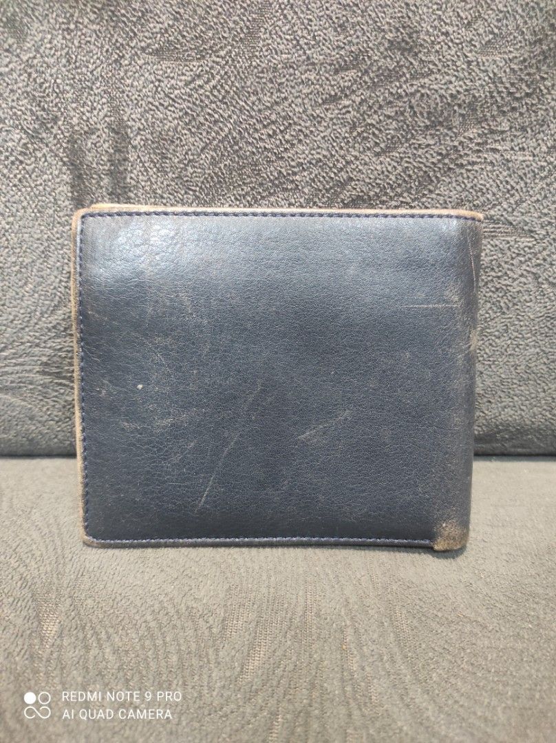 Christian Dior CD Monogram Leather Bifold Wallet (Category: Luxury Bags & Wallets) located in Mabalacat. Submitted by _limitlessfashion (Listing ID 1443412322, Image 2). Description: - Vintage Christian Dior bifold wallet - Guaranteed Authentic - Leather all the way (Inside/Out) - Need repolish only, walang bakbak sa leather - No other issues - Black leather exterior with embossed CD logo - Red leather interior - Multiple card slots and coin pock