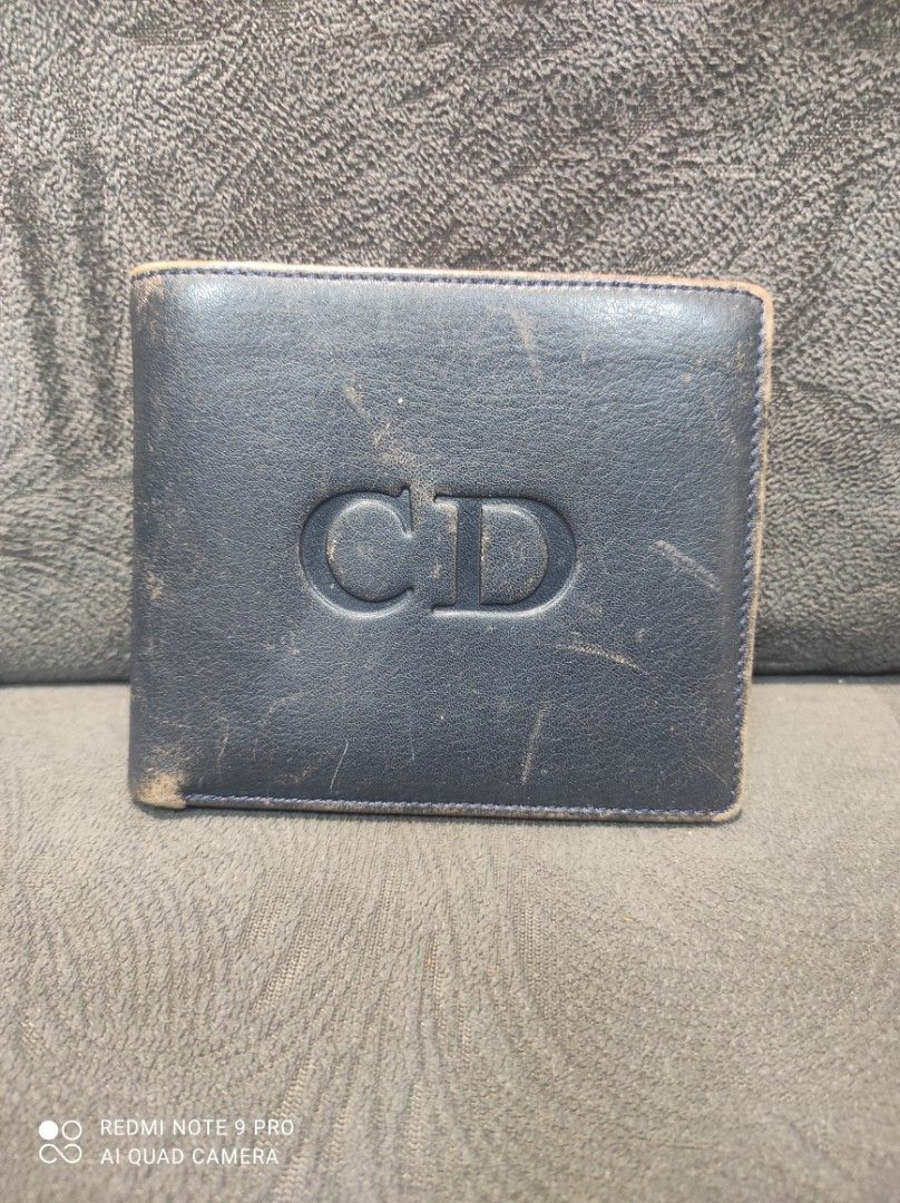 Christian Dior CD Monogram Leather Bifold Wallet (Category: Luxury Bags & Wallets) located in Mabalacat. Submitted by _limitlessfashion (Listing ID 1443412322, Image 1). Description: - Vintage Christian Dior bifold wallet - Guaranteed Authentic - Leather all the way (Inside/Out) - Need repolish only, walang bakbak sa leather - No other issues - Black leather exterior with embossed CD logo - Red leather interior - Multiple card slots and coin pock