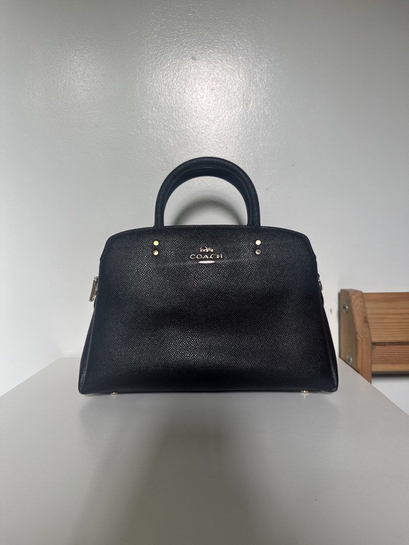 Coach Handbag (Category: Luxury Bags & Wallets) located in Batangas. Submitted by z.declutter (Listing ID 1443373632, Image 1). Description: Authentic Black Coach Handbag with detachable sling. There are dents on two corners. Please see photos for reference. Bought it yrs ago from coach outlet for almost 10k.