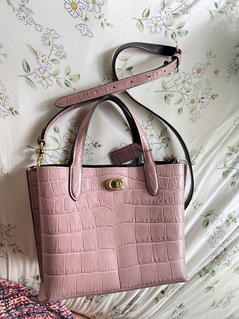 Coach Pink Croc Embossed Leather Tote Bag (Category: Shoulder Bags) located in Manila. Submitted by angelsnoow (Listing ID 1443351814, Image 1). Description: - Coach pink croc embossed leather tote bag - Features a secure turn-lock closure - Includes a detachable crossbody strap for versatile carrying - Comfortable top handles - Comes with original Coach hangtag - Ideal for both daily errands and special events.