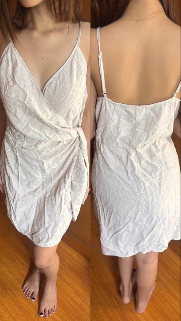 Cream Wrap Tie Mini Dress Spaghetti Straps (Category: Dresses) located in Pasig City. Submitted by ablncl (Listing ID 1443466354, Image 1). Description: - Cute cream mini dress - Features a wrap front with side tie detail - Breezy spaghetti straps - Nice textured fabric - Versatile for casual day or night out - Easy to style with sandals or heels.