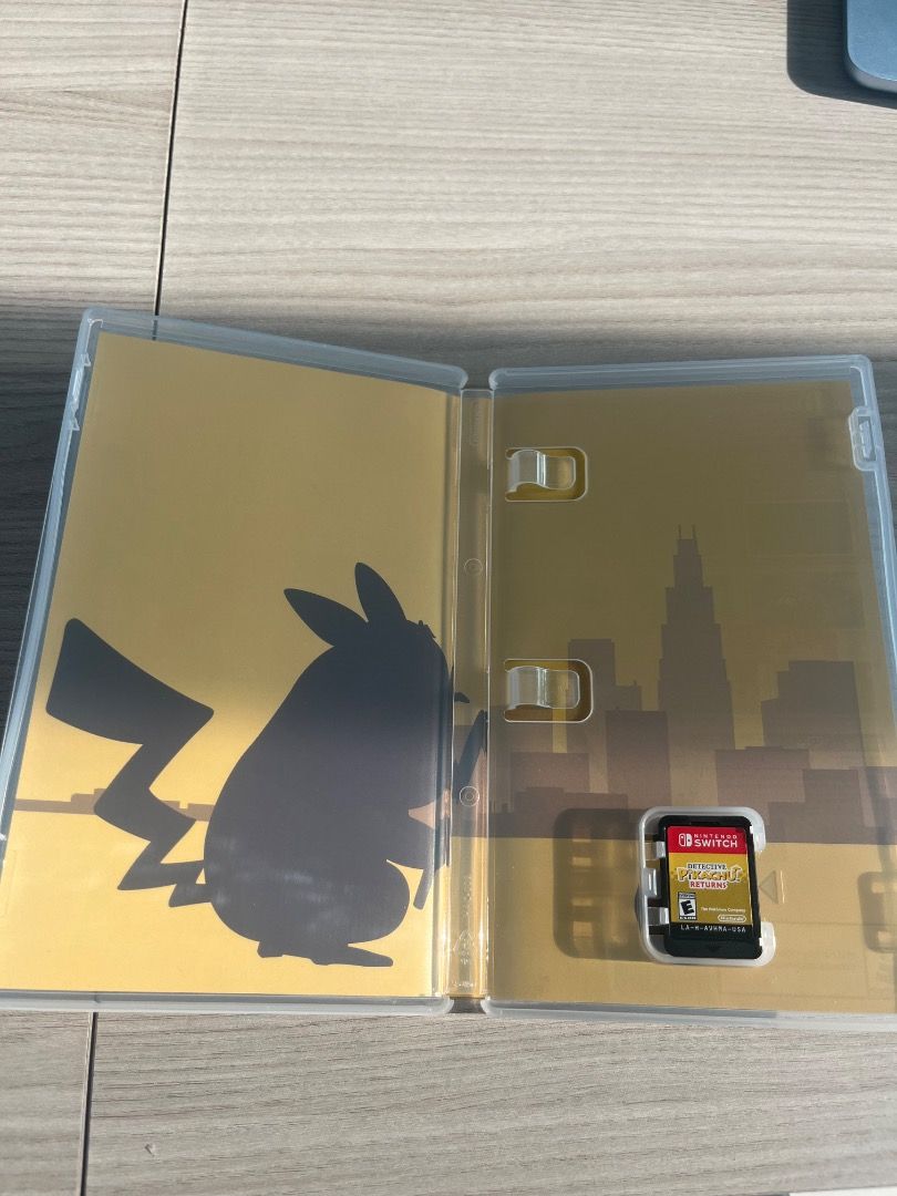 Detective Pikachu Returns Nintendo Switch Game (Category: Nintendo) located in Caloocan City. Submitted by valuegiver2 (Listing ID 1443439874, Image 2). Description: - Detective Pikachu Returns for Nintendo Switch - Join Pikachu and Tim on investigations - Explore Ryme City and solve cases with Pokémon help - Game includes original case and cartridge - Published in 2022.
