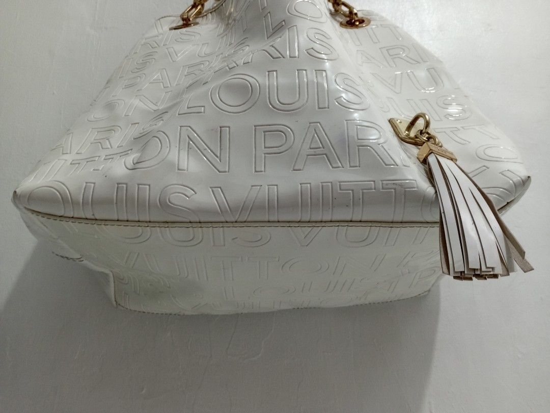 ELEGANT White LV Monogram Embossed BIG TOTE BAG (Category: Luxury Bags & Wallets) located in Manila. Submitted by eriiicaspage (Listing ID 1443397490, Image 3). Description: PreOWNED WellUsed Elegant White Louis Vuitton Monogram Embossed Logo Large TOTE Bag LARGE -XL - Iconic Monogram Pattern Embossed All Over in Patent leather - Gold Chain and Leather Strap - Stylish Tassel Detail on the Side - Luxurious Brown Suede Interior Lining - Secure Snap
