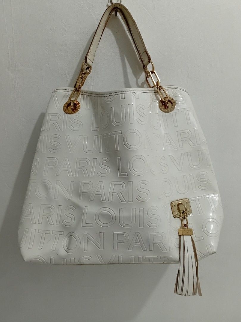 ELEGANT White LV Monogram Embossed BIG TOTE BAG (Category: Luxury Bags & Wallets) located in Manila. Submitted by eriiicaspage (Listing ID 1443397490, Image 1). Description: PreOWNED WellUsed Elegant White Louis Vuitton Monogram Embossed Logo Large TOTE Bag LARGE -XL - Iconic Monogram Pattern Embossed All Over in Patent leather - Gold Chain and Leather Strap - Stylish Tassel Detail on the Side - Luxurious Brown Suede Interior Lining - Secure Snap
