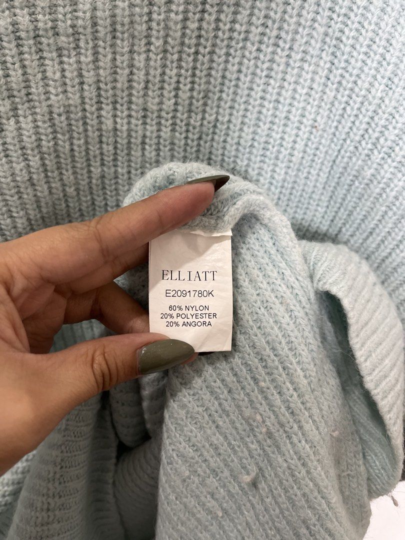 ELLIATT Light Blue Knit Sweater M-L (Category: Longsleeves) located in Baguio. Submitted by threadsandcrafts (Listing ID 1443361230, Image 2). Description: - Light blue knit sweater from ELLIATT - Made with a blend of nylon, polyester, and angora - Features a unique shoulder cut-out detail - Tag size: M-L - Designed in Australia, Made in China - Care instructions: Cool gentle hand wash separately, do not iron.