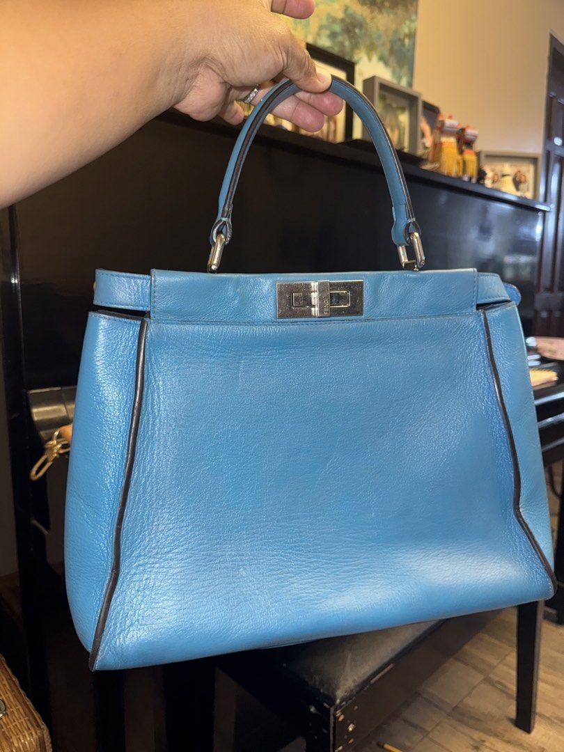 Fendi Blue Leather Large Peekaboo Top Handle Bag (Category: Tote Bags) located in Polomolok. Submitted by matabako (Listing ID 1443471200, Image 1). Description: Fendi Blue Leather Large Peekaboo Top Handle Bag THE DETAILS Highlights Color: blue Serial No: 8BN226-P61139-2372 This item has no inclusions. Condition: GOOD. This previously owned and used item is in good condition with minimal signs of use. This may include fading of material or plati