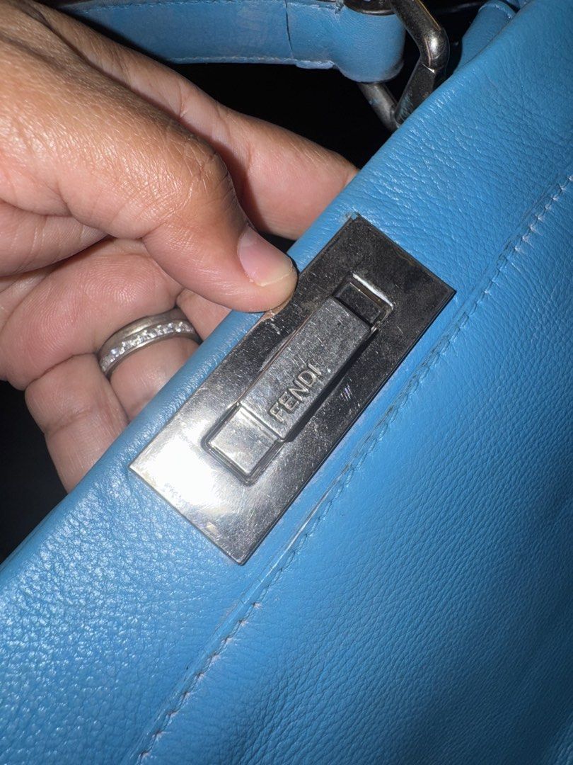 Fendi Blue Leather Large Peekaboo Top Handle Bag (Category: Tote Bags) located in Polomolok. Submitted by matabako (Listing ID 1443471200, Image 2). Description: Fendi Blue Leather Large Peekaboo Top Handle Bag THE DETAILS Highlights Color: blue Serial No: 8BN226-P61139-2372 This item has no inclusions. Condition: GOOD. This previously owned and used item is in good condition with minimal signs of use. This may include fading of material or plati