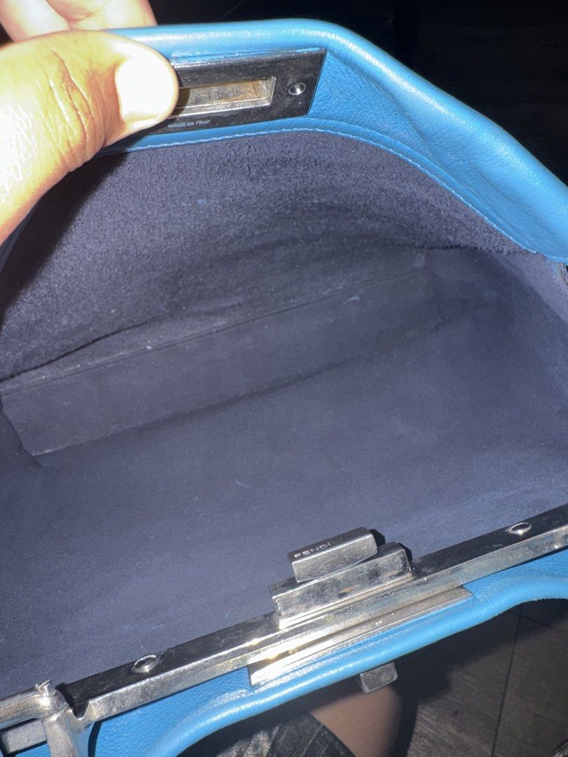 Fendi Blue Leather Large Peekaboo Top Handle Bag (Category: Tote Bags) located in Polomolok. Submitted by matabako (Listing ID 1443471200, Image 3). Description: Fendi Blue Leather Large Peekaboo Top Handle Bag THE DETAILS Highlights Color: blue Serial No: 8BN226-P61139-2372 This item has no inclusions. Condition: GOOD. This previously owned and used item is in good condition with minimal signs of use. This may include fading of material or plati
