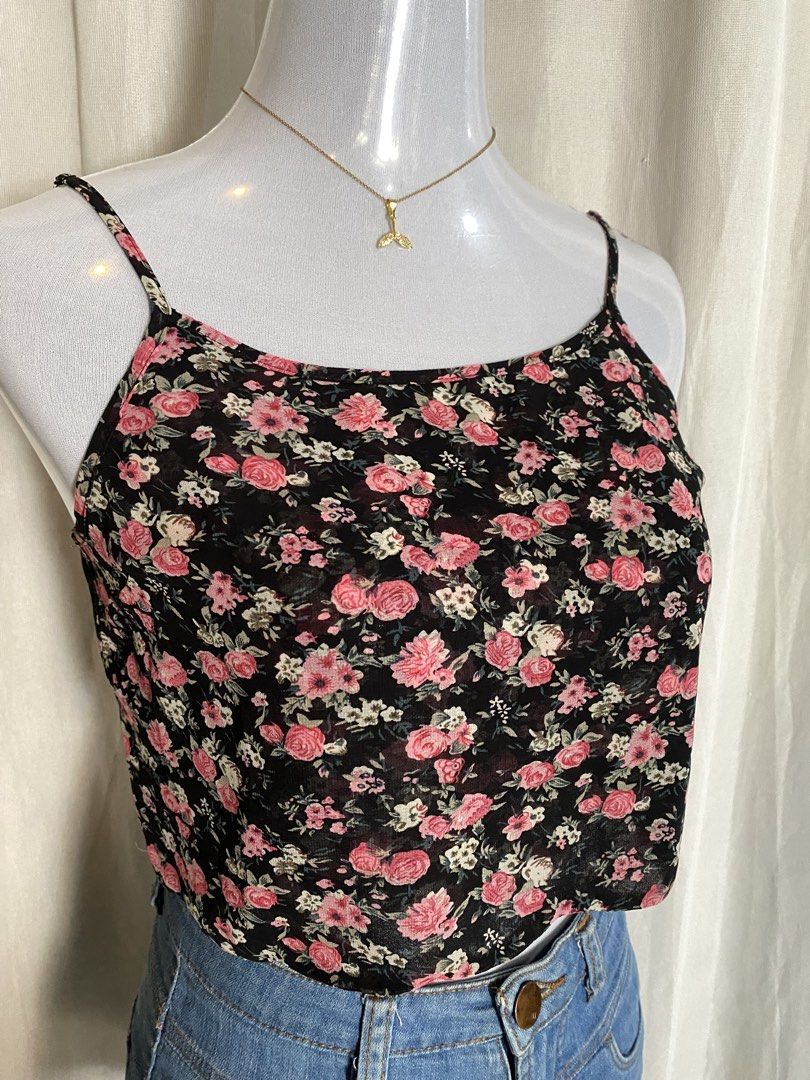 Forever 21 Floral Mesh Crop Top (Category: Others Tops) located in Manila. Submitted by cami0110 (Listing ID 1443433130, Image 2). Description: - Cute floral mesh crop top - Brand: Forever 21 - Color: Black base with pink and white flowers - Features: Thin spaghetti straps - Styling: Perfect with high-waisted shorts or jeans - Occasion: Casual outings or nights with friends.