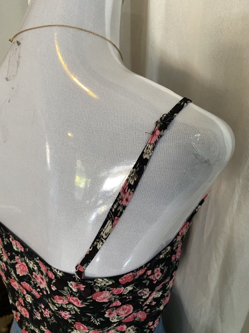 Forever 21 Floral Mesh Crop Top (Category: Others Tops) located in Manila. Submitted by cami0110 (Listing ID 1443433130, Image 3). Description: - Cute floral mesh crop top - Brand: Forever 21 - Color: Black base with pink and white flowers - Features: Thin spaghetti straps - Styling: Perfect with high-waisted shorts or jeans - Occasion: Casual outings or nights with friends.